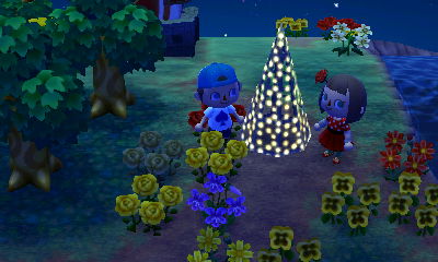 Standing by Wendy's illuminated tree.