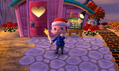 Santa Jeff holding a yellow glow wand.