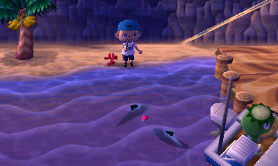 Two sharks swimming in the ocean, near the dock.