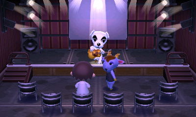 Kidd stares at me as K.K. performs at Club LOL.