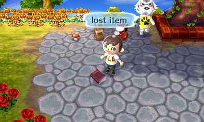 A lost item on the ground near the town tree. Rolf walks by in the background.