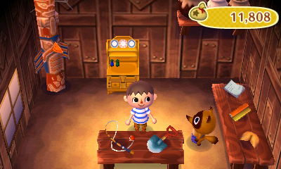 A fishing rod and shovel on sale at Nookling Junction.