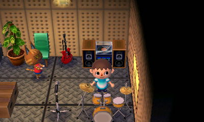Katt applauds me after I bang on her drums.