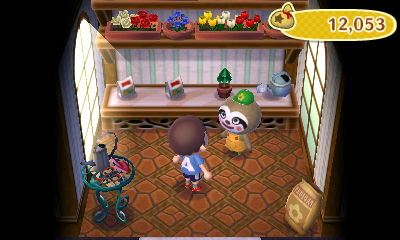 The inside of the garden shop, along with its owner, Leif the sloth.