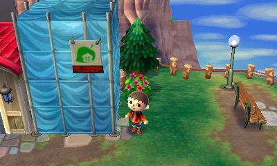 Blue tarp covering construction next to Able Sisters. It's going to be Kicks!