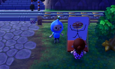 Wendy and Rae trying out my stick figure face cutout standee design.