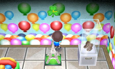 A shamrock clock from Gulliver hanging on the wall.