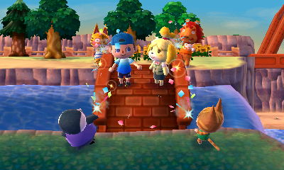 Party poppers go off at the completion ceremony for the brick bridge PWP.