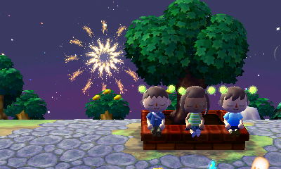 Watching fireworks (with our eyes closed?) while sitting on the town tree.