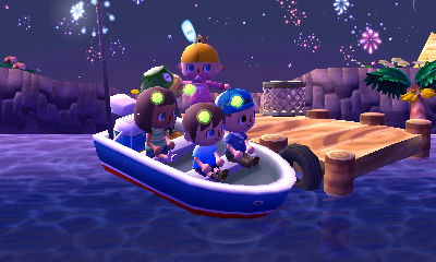 Getting onto Kapp'n's boat as fireworks go off in the distance.