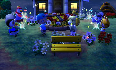 Everyone fires party poppers at the completion ceremony for the flower clock PWP.