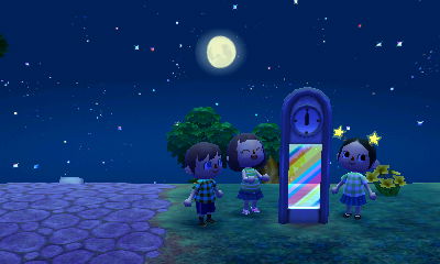 Jeff, Wendy, and Meli watch as the modern clock lights up at the stroke of midnight.