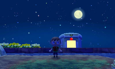 The moon and the clear night sky, as seen from across the river from the police station.