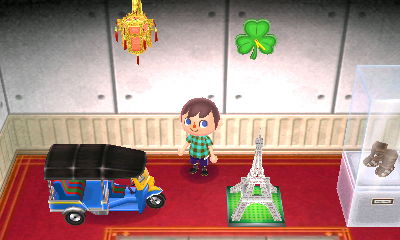 A red tasseled lantern, that I got from Gulliver, hanging on the wall.