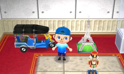The tuk tuk that Gulliver sent me from Thailand, next to my Eiffel tower.