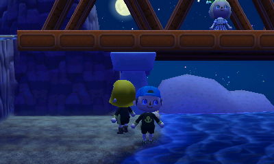 Daisy and I, on the private beach, look up at Wendy, who is on the bridge above us.