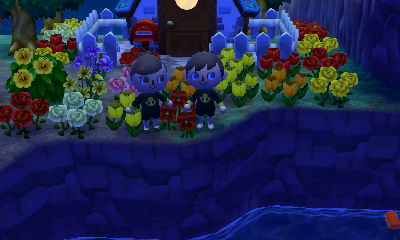 Me and Wendy wearing wet suits at the top of a cliff, ready to jump off.