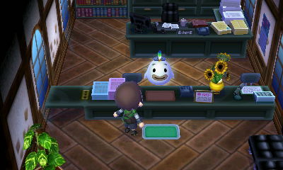 Wisp standing behind the counter at town hall.