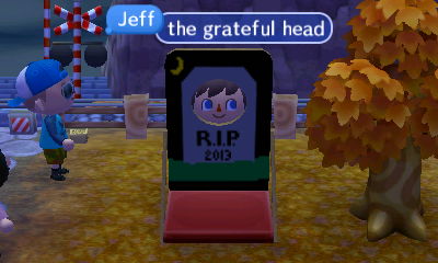 Jeff, sticking his face through a gravestone faceboard: The Grateful Head.