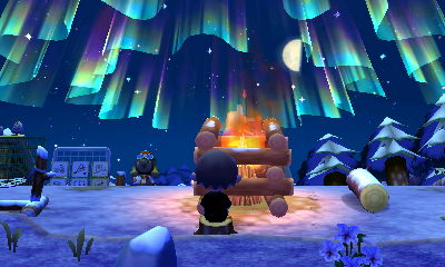 Sitting by the fire at the campground, watching the northern lights up in the sky.