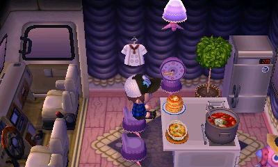 Me sitting in Franklin's RV, near a delicious stack of pancakes.