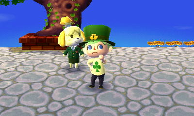 Jeff wearing a shamrock hat next to Isabelle on Shamrock Day (St. Patrick's Day).