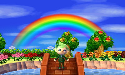 Jeff stands underneath a rainbow in the dream town of Shamrock.