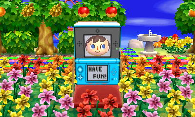 A Nintendo DS face cutout standee says "Have fun!"