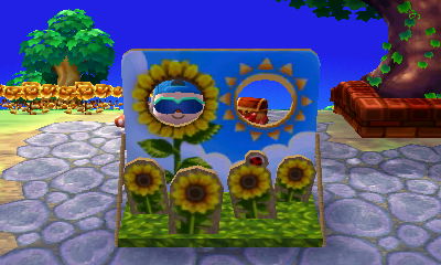 Jeff sticks his face through the face-cutout standee for the summer solstice in Animal Crossing: New Leaf for Nintendo 3DS.