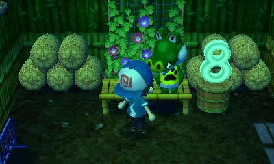 Boots sits in his house, next to his eight lamp.