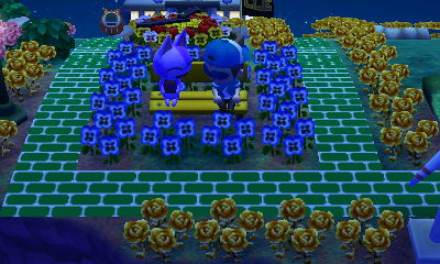 Bob and Jeff sit on a yellow bench PWP in Animal Crossing: New Leaf for Nintendo 3DS.
