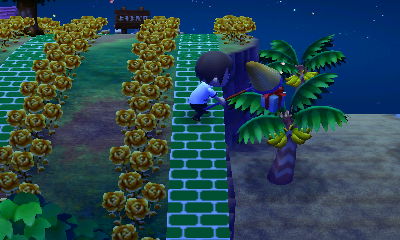 Jeff smacks down a balloon present with a net.