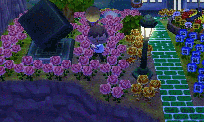 Animated GIF of a monarch flying at night, near a street lamp.