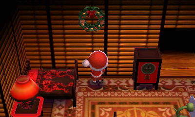 Jeff hangs up the festive wreath from Jingle in his house.