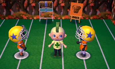 Jeff's football themed room, with two mannequin football players and a scoreboard.