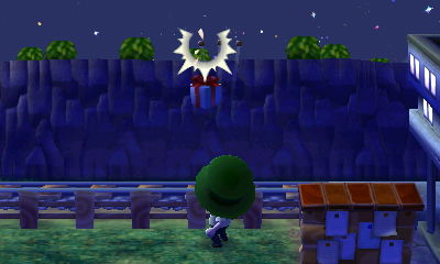 Jeff shoots down a balloon present next to the bulletin board and train tracks.