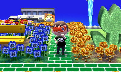 Isabelle stands near town hall and the geyser erupts and I stand near a yellow bench and tulip topiary.