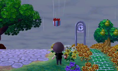 A present falls from the sky after I popped the balloon it was flying on.