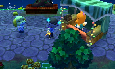 Jeff sets off a sparkler between Isabelle and Crazy Redd during the fireworks festival.