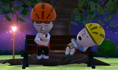 Kevin Love and Charlie Brown napping on a bench in the park.
