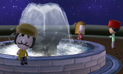 Madeline winks at the camera as Annyong and Ann hang out at the fountain.