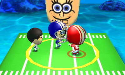 Playing a game of football with SpongeBob.