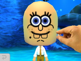 Picking some crumbs off of SpongeBob's face.