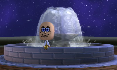 SpongeBob sits at the fountain.