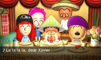 Xavier's friends wish him a happy birthday at his birthday party.